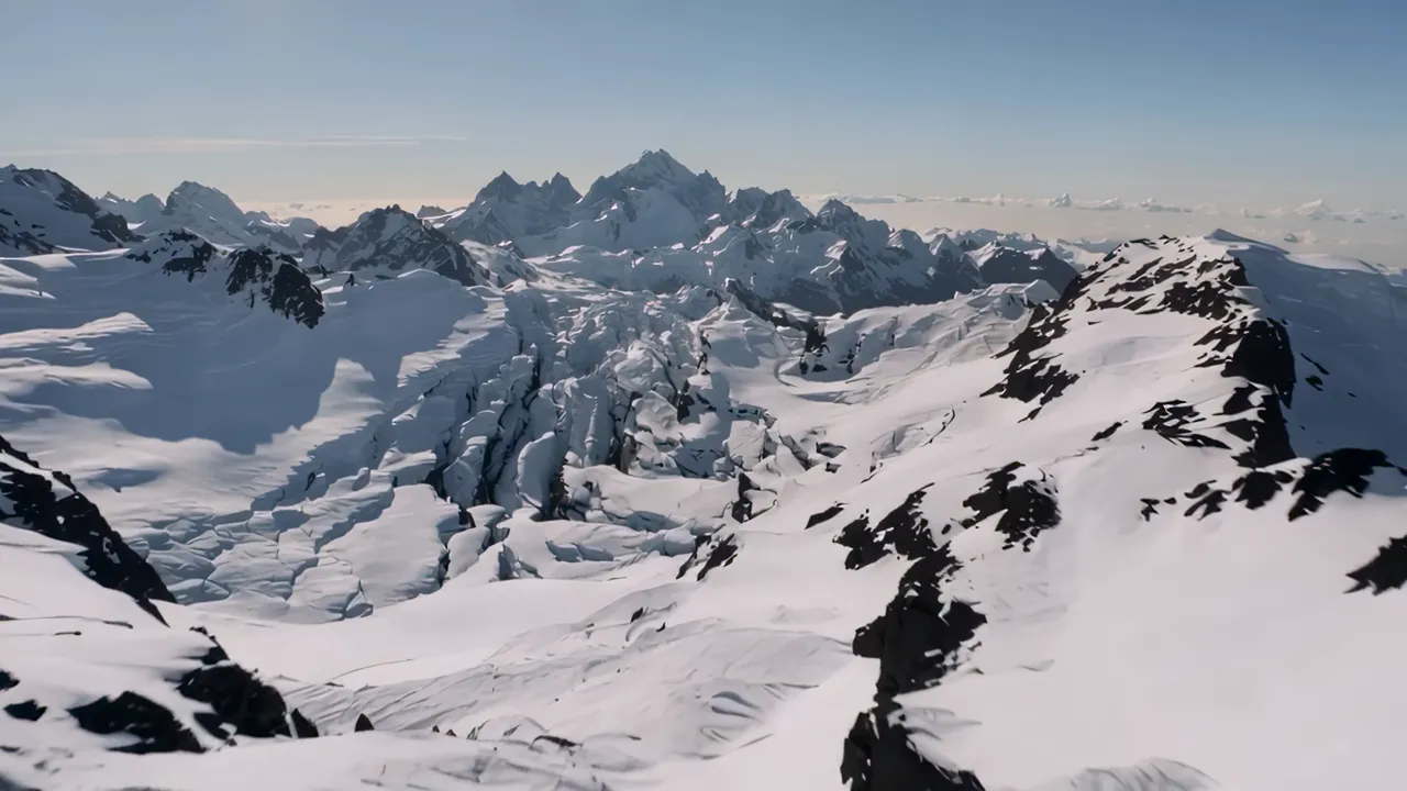 Aerial Drone Shot of Snow-Capped Mountain Range