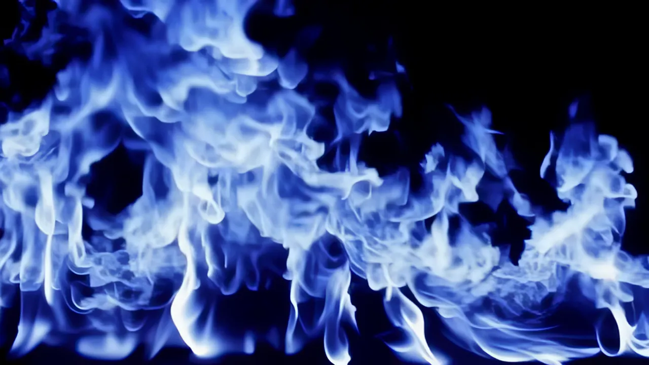 Blue Flames Rippling and Churning Against a Dark Background