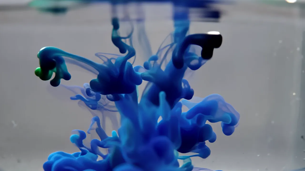 Blue Ink Drop Spreading in Still Water