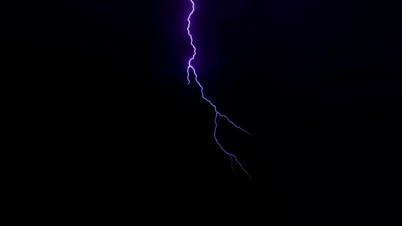 Bold Lightning Bolt Descending Against Dark Background