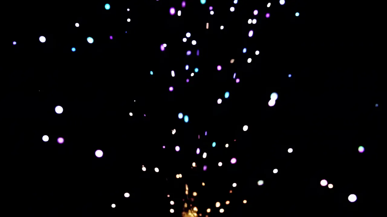 Colorful Light Fragments Gently Descending in Darkness