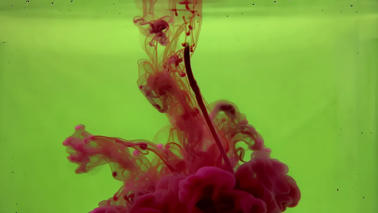 Crimson Red Ink Cloud Dissolving in Water