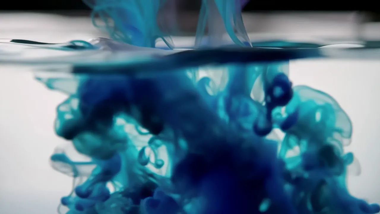 Deep Blue Ink Drop Blooming in Water Surface