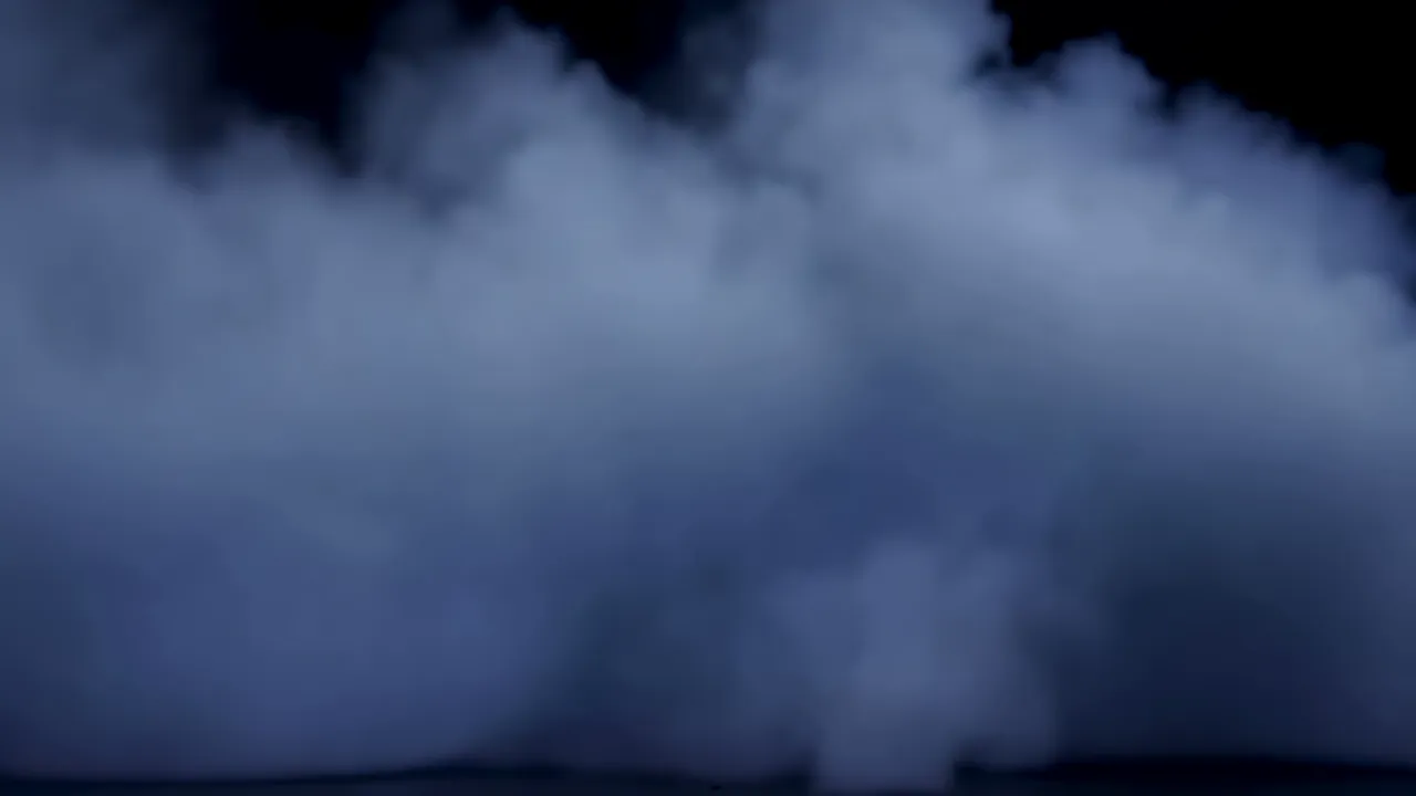 Dense Fog Slowly Advancing Across a Dark Background