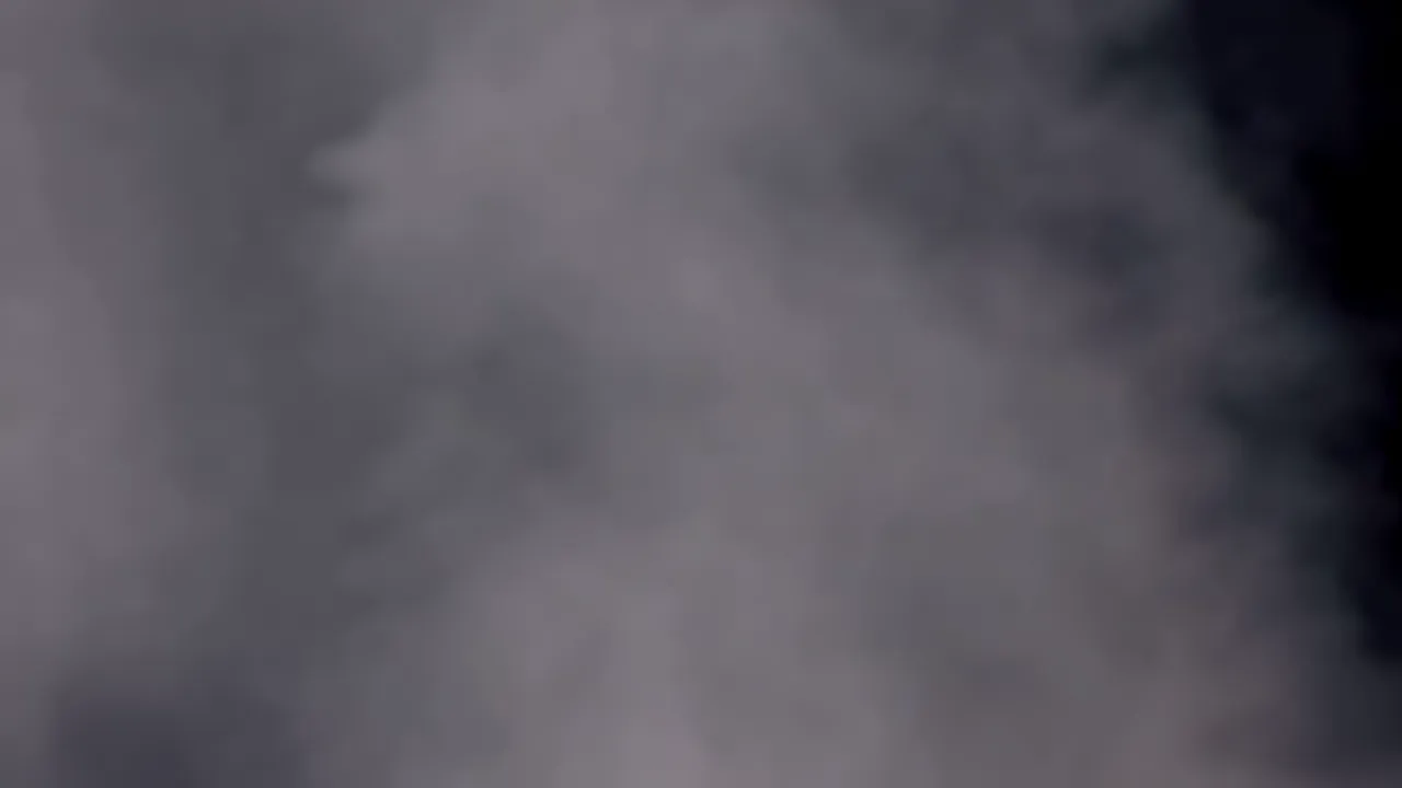 Dense Fog Wall Advancing Across a Black Background