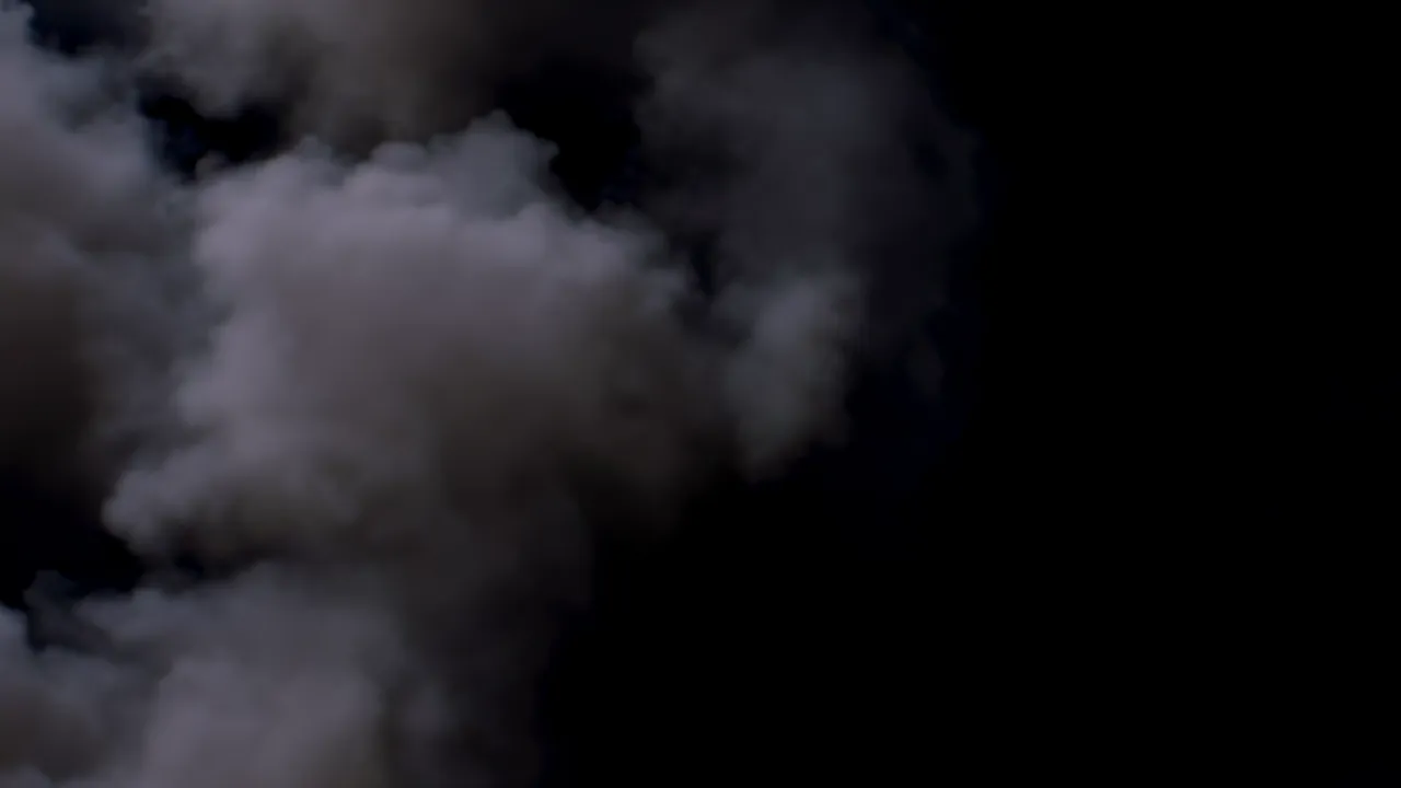 Dense Fog Wall Advancing Against Black Background