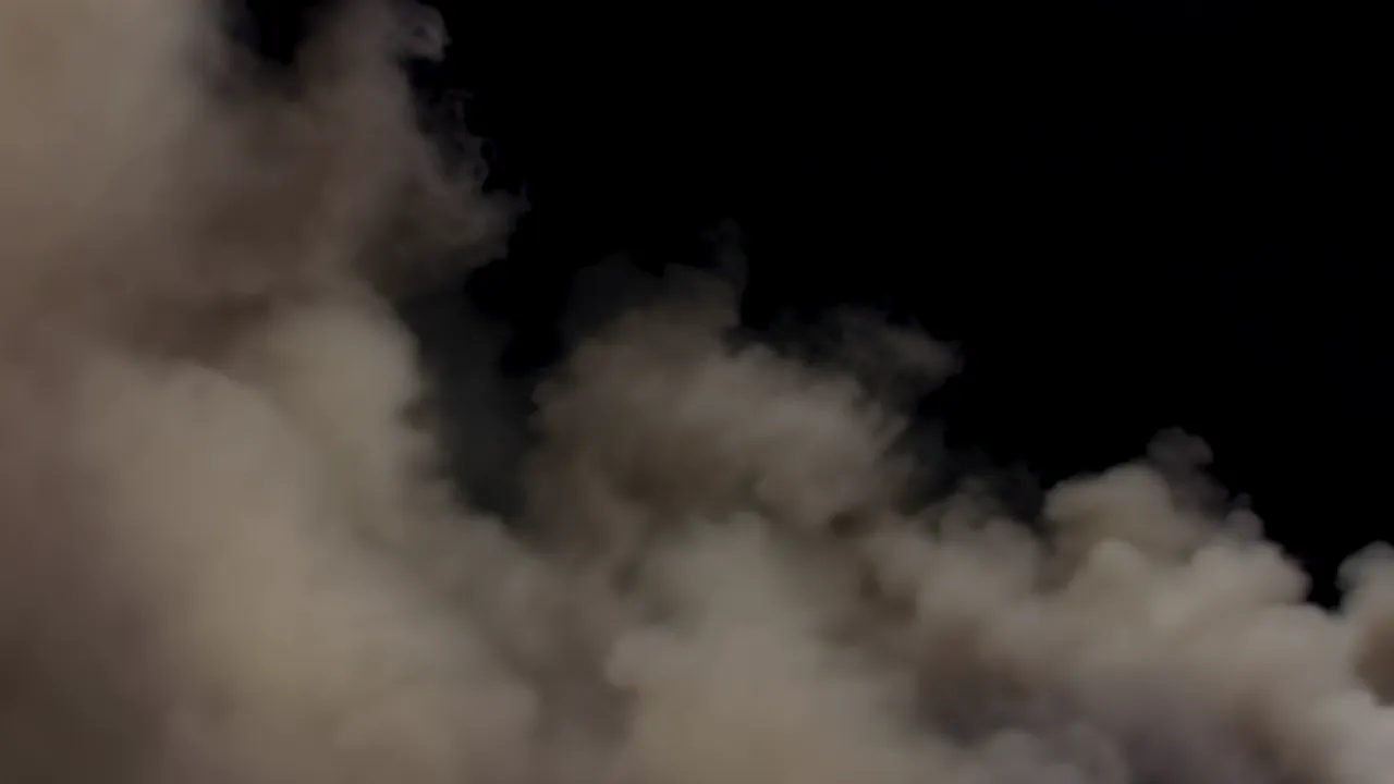 Dense Fog Wall Advancing Against Black Background