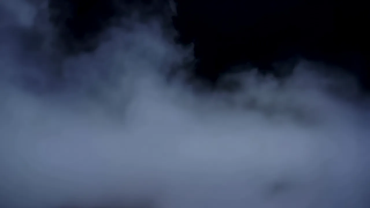 Dense Ground Fog Rolling Across a Dark Background