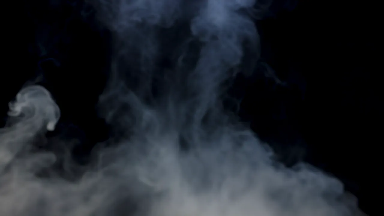 Gentle Haze of Smoke Flowing Across a Dark Background