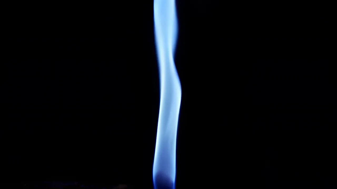 Graceful Flame Twisting Against Black Background