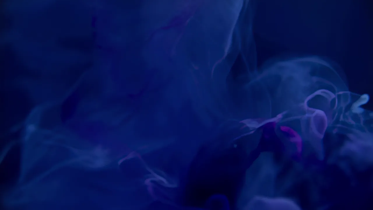 Ink Cloud Expanding and Dissolving in Blue Liquid