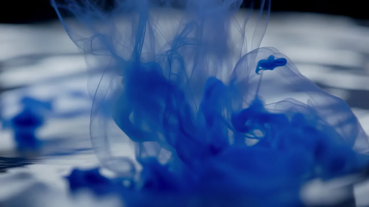 Ink Drop Dissolving in Water Creating Abstract Patterns