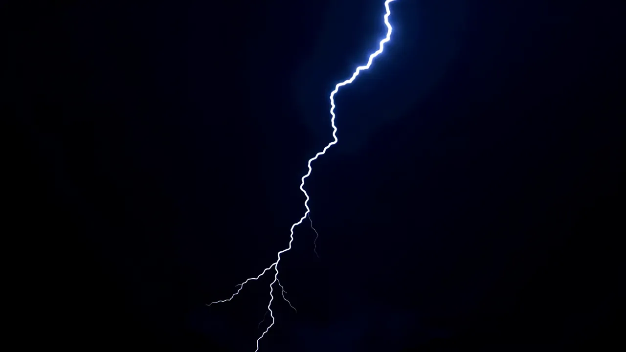 Intense Lightning Strike Illuminating the Night Sky
