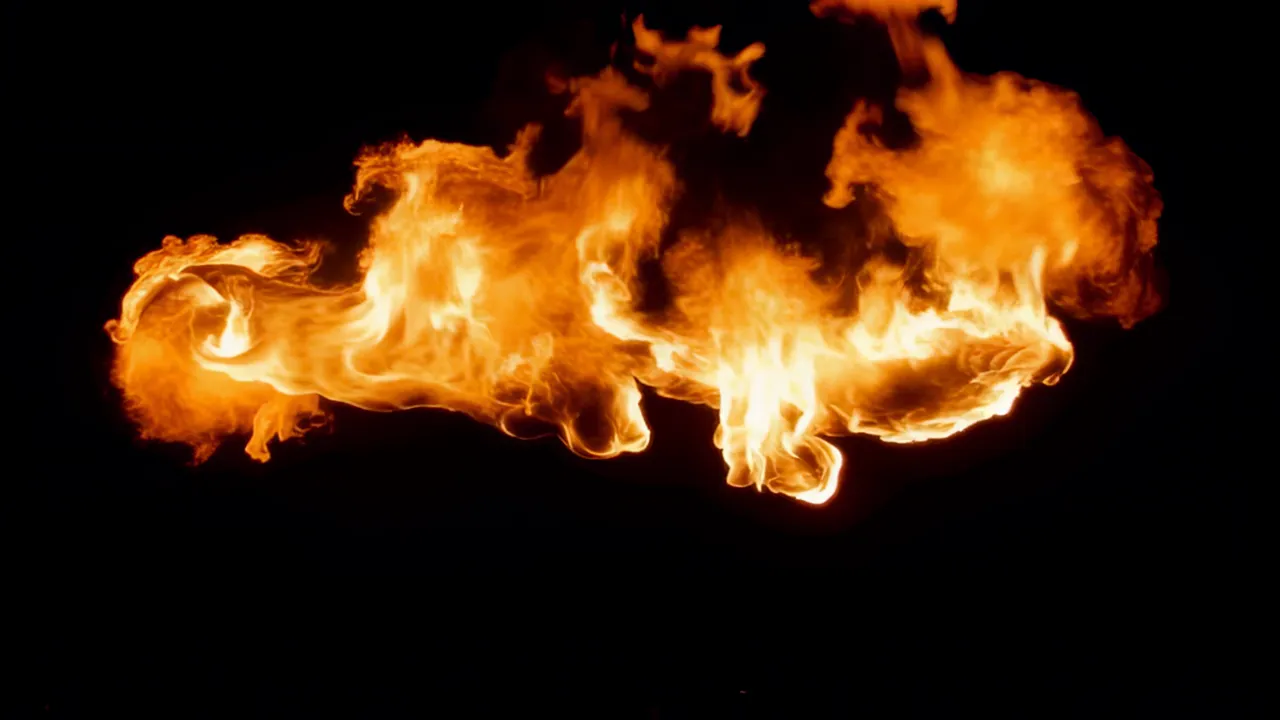 Large Fire Tendril Curling Across a Dark Background