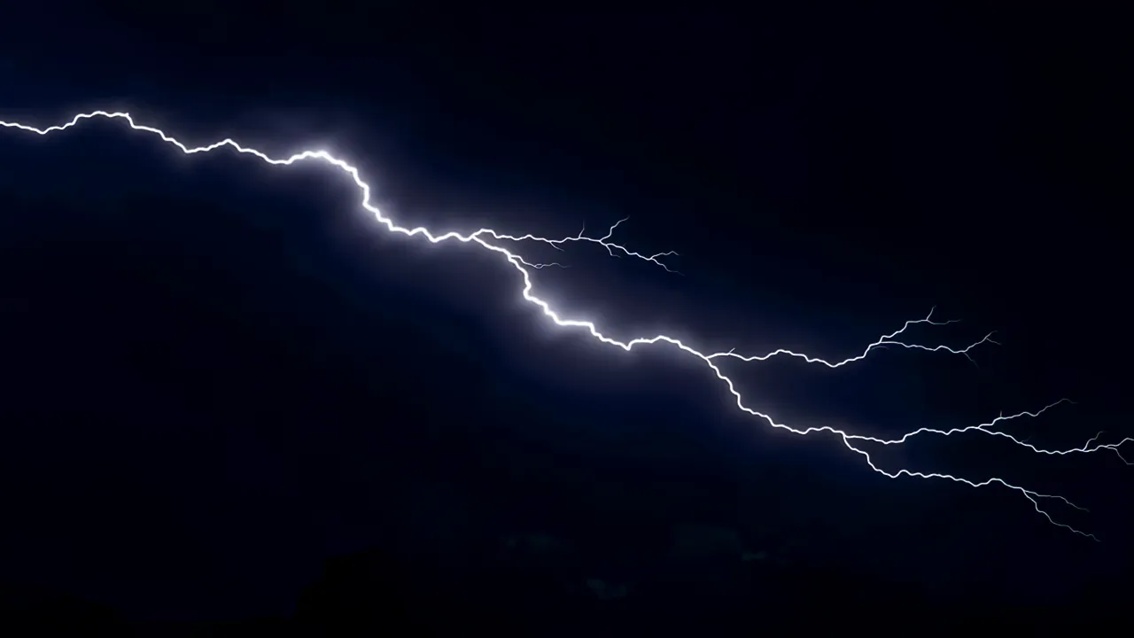 Large Lightning Bolt Striking Across Dark Sky