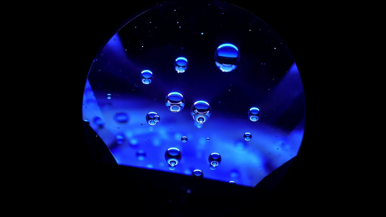 Microscope Image of Sapphire with Liquid Inclusions