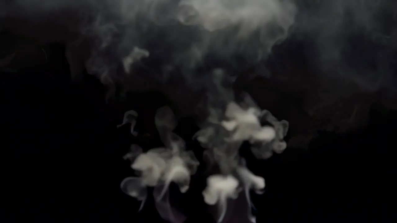 Pale Smoke Spreading Diffusely on Black Background