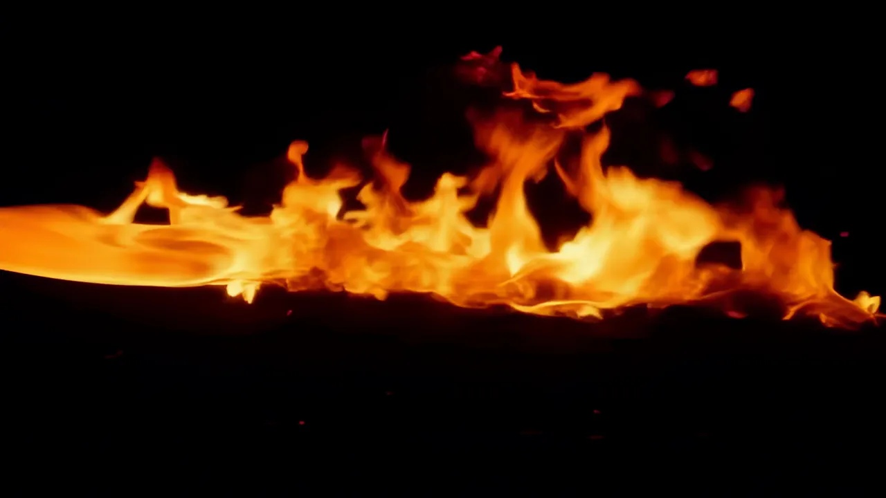 Rolling Orange Fire Wave in Darkness