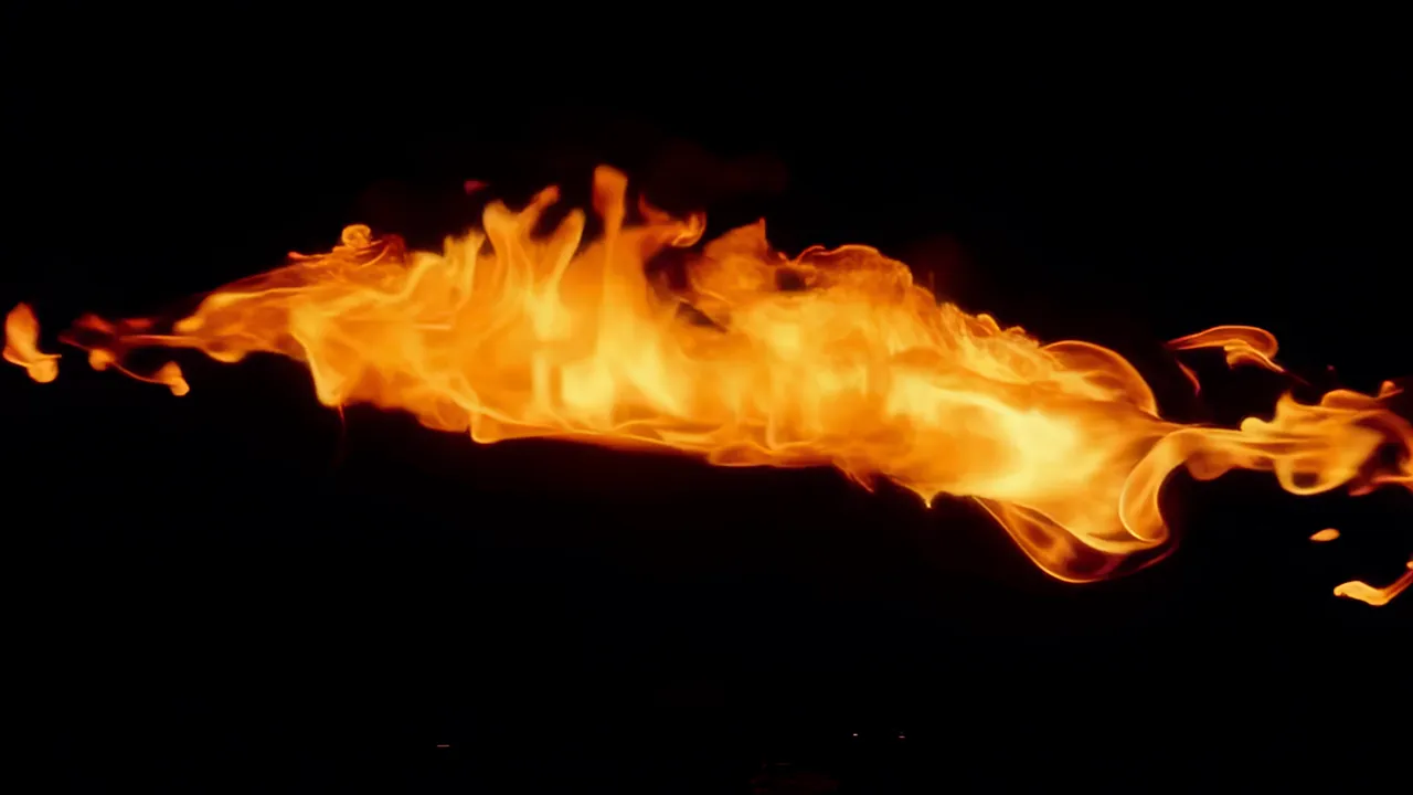 Rolling Wave of Orange Fire Against Black Background