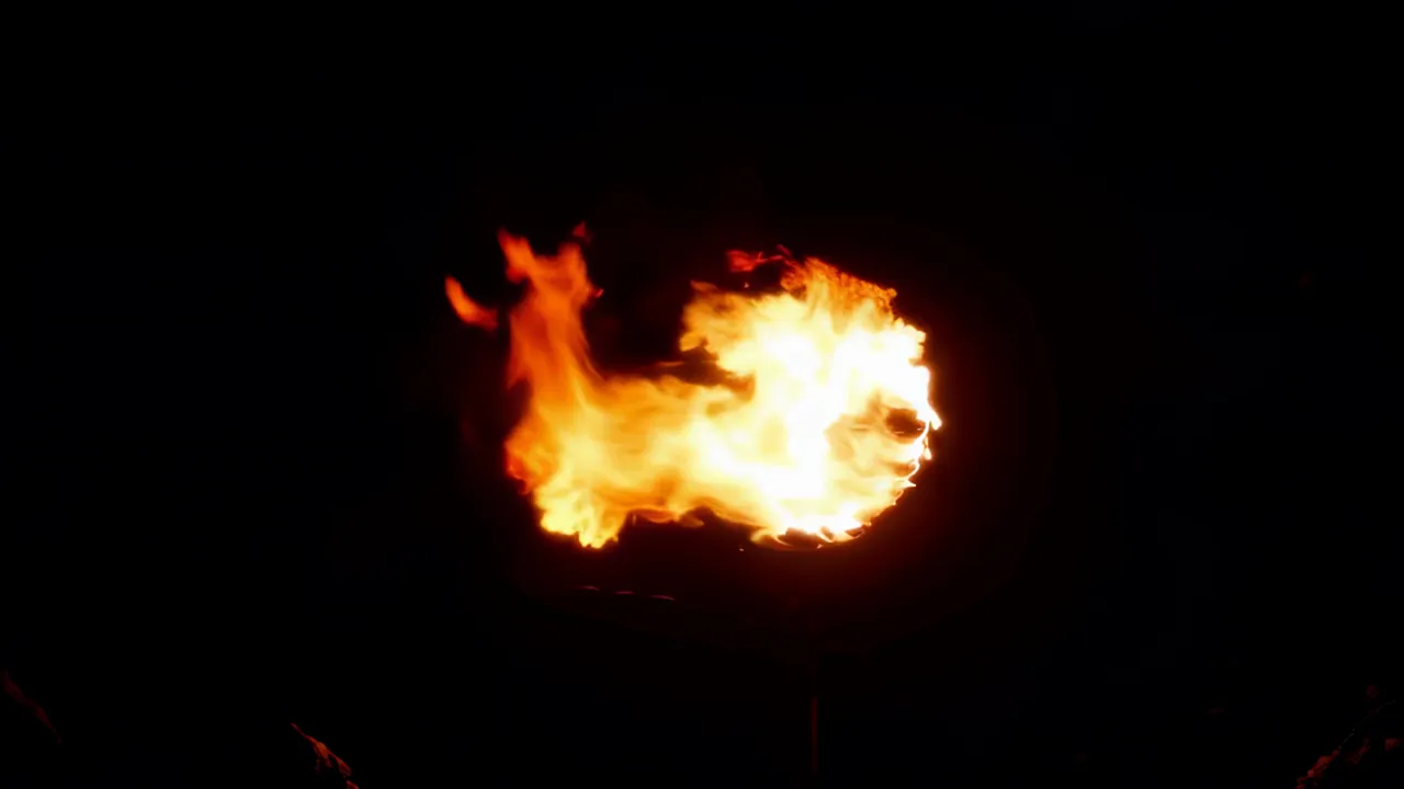Rolling Wave of Orange Fire against Black Background