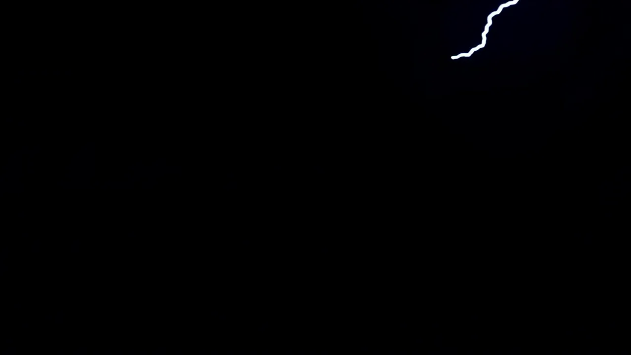 Single Bolt of Lightning Illuminating the Dark Sky