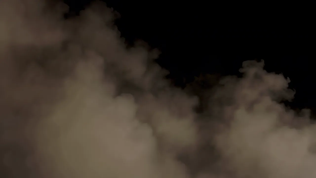 Slowly Drifting Fog Bank Against Black Background