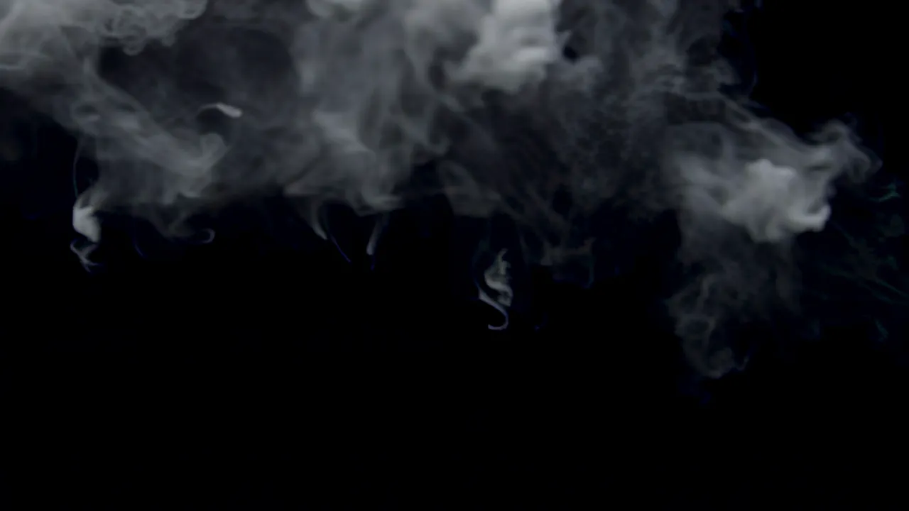 Soft Atmospheric Haze of Pale Smoke on Black Background