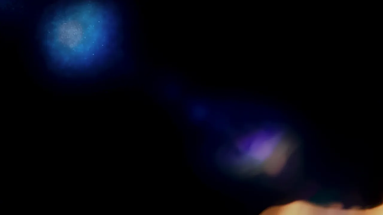 Soft Blue Light Leak on Black Background