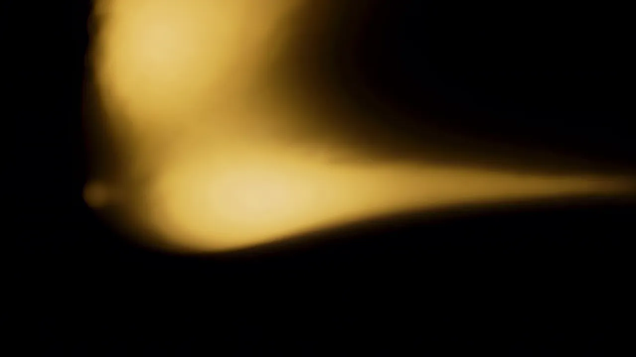 Soft Light Bloom Expanding Across Black Background