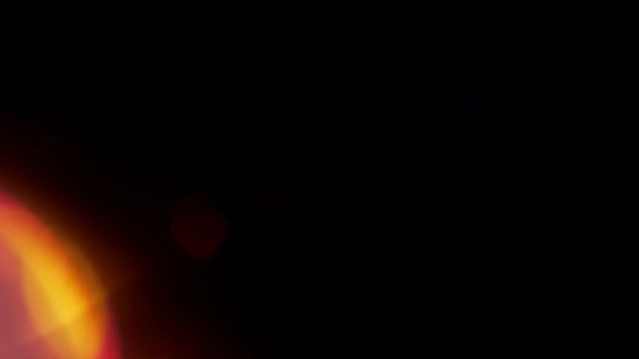 Soft Red and Orange Light Bloom on Black Background