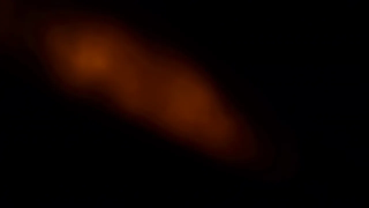 Soft Red and Orange Light Blooming from Black Background