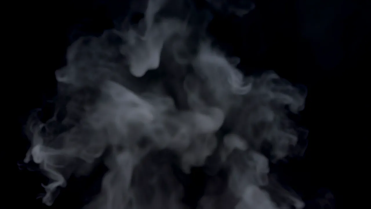 Steam Vapor Rising Gently Against Black Background