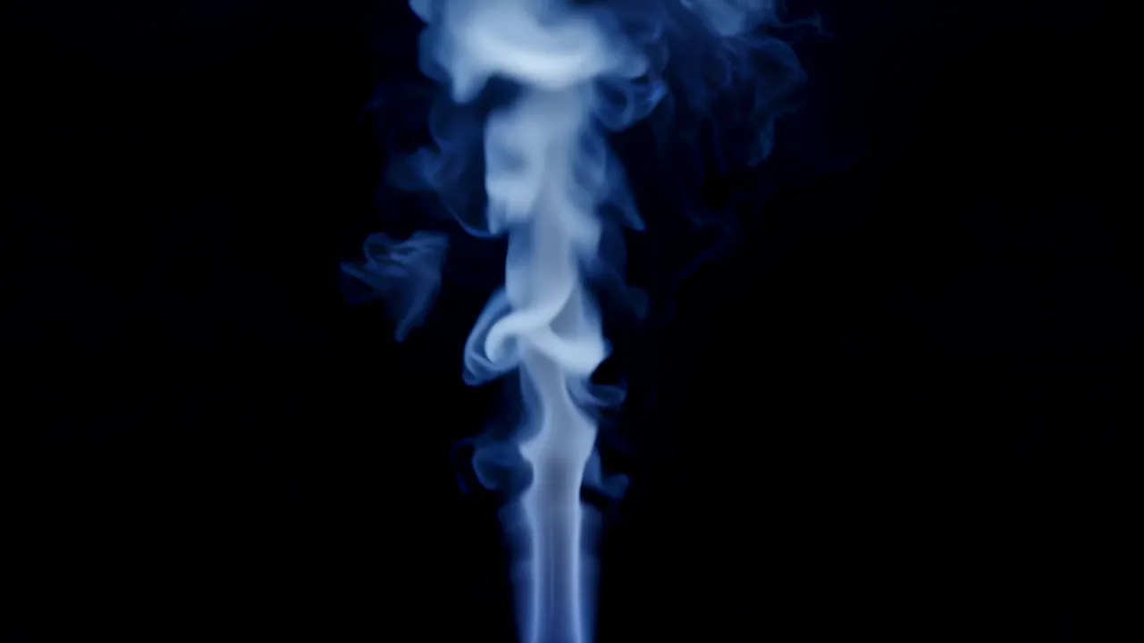 Steam Vapor Rising Softly Against Black Background