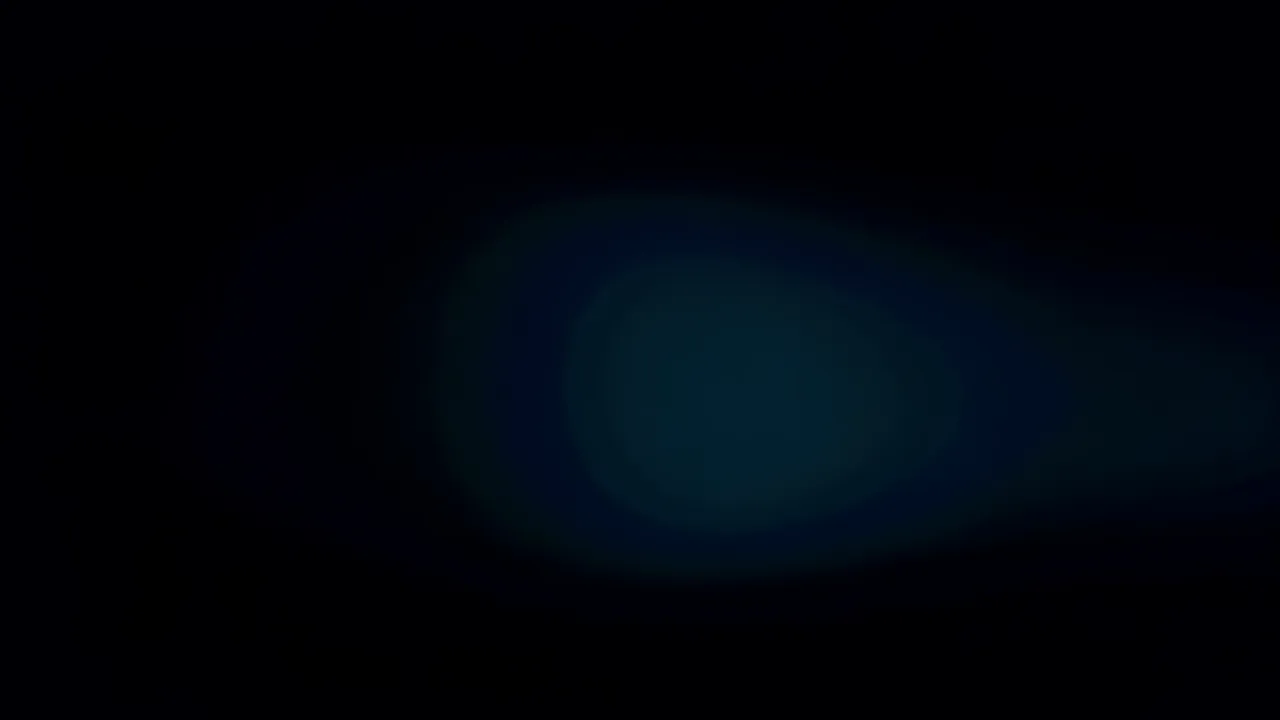 Teal and Cyan Light Bloom Expanding on Black Background