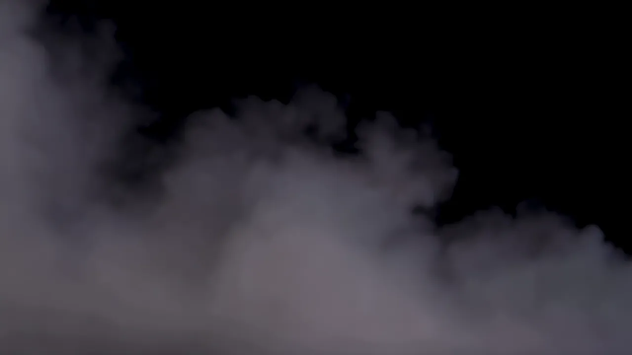 Thick Fog Spreading Horizontally Against Black Background