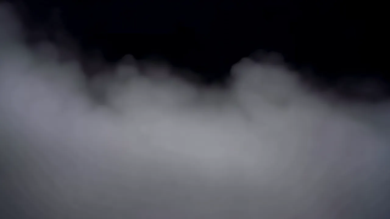 Thick Fog Spreading Horizontally Against Dark Background