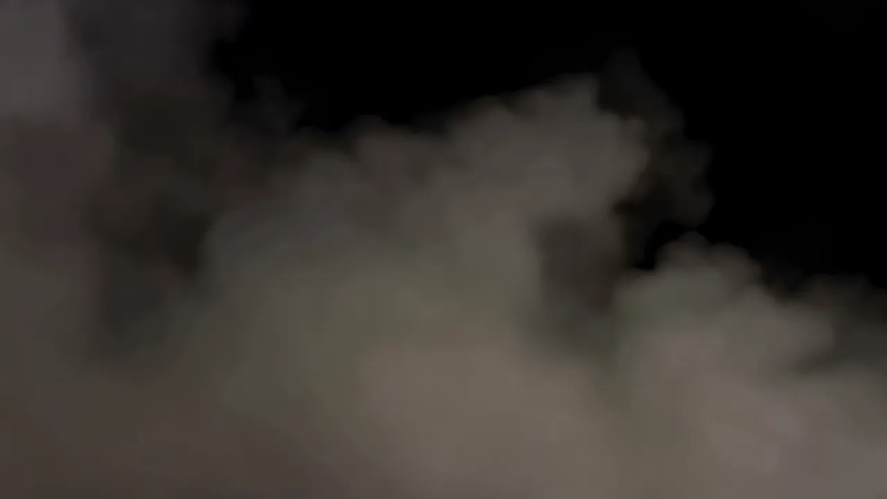 Thick Low-Lying Fog Spreading Horizontally on Black Background