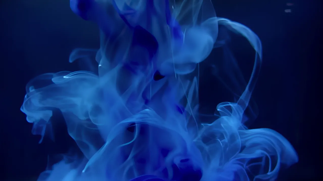 Thick Oil Paint Swirling in Water with Vibrant Colors