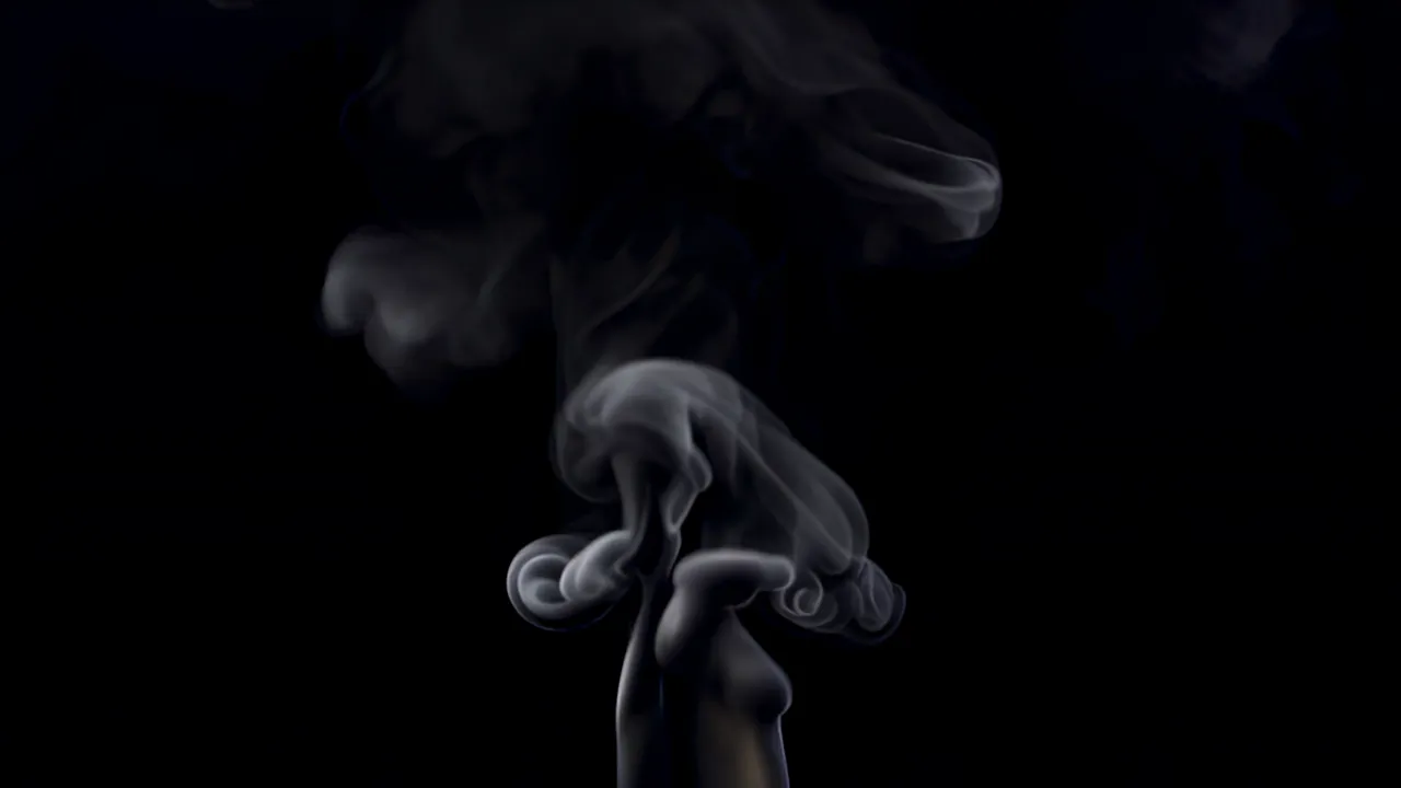 Thin Curling Smoke Filament Twisting in Darkness