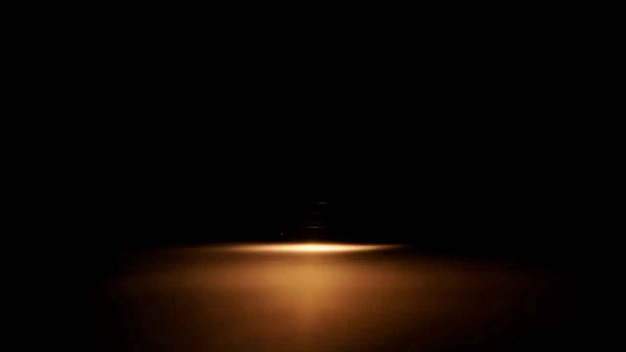 Warm Amber Light Wash on Black Background