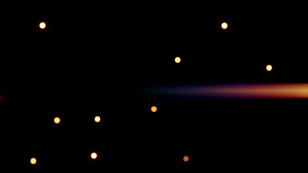 Warm Golden Bokeh Orbs Drifting on a Black Background