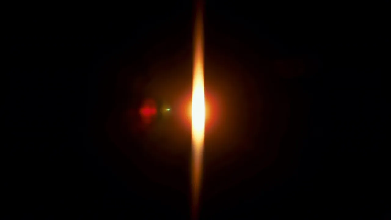 Warm Golden Light Streak on Black Background